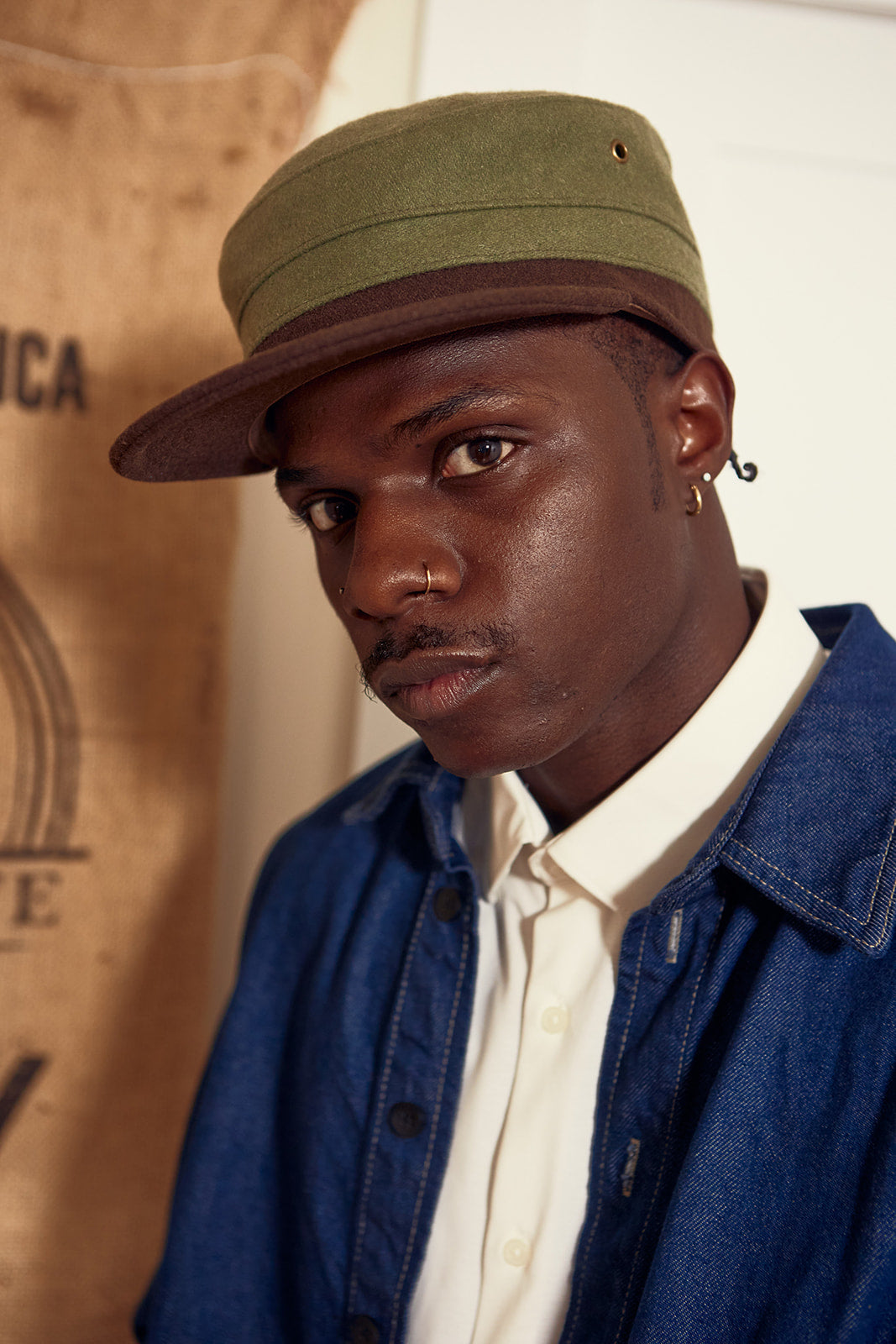 an influencer wearing few and far cap merch